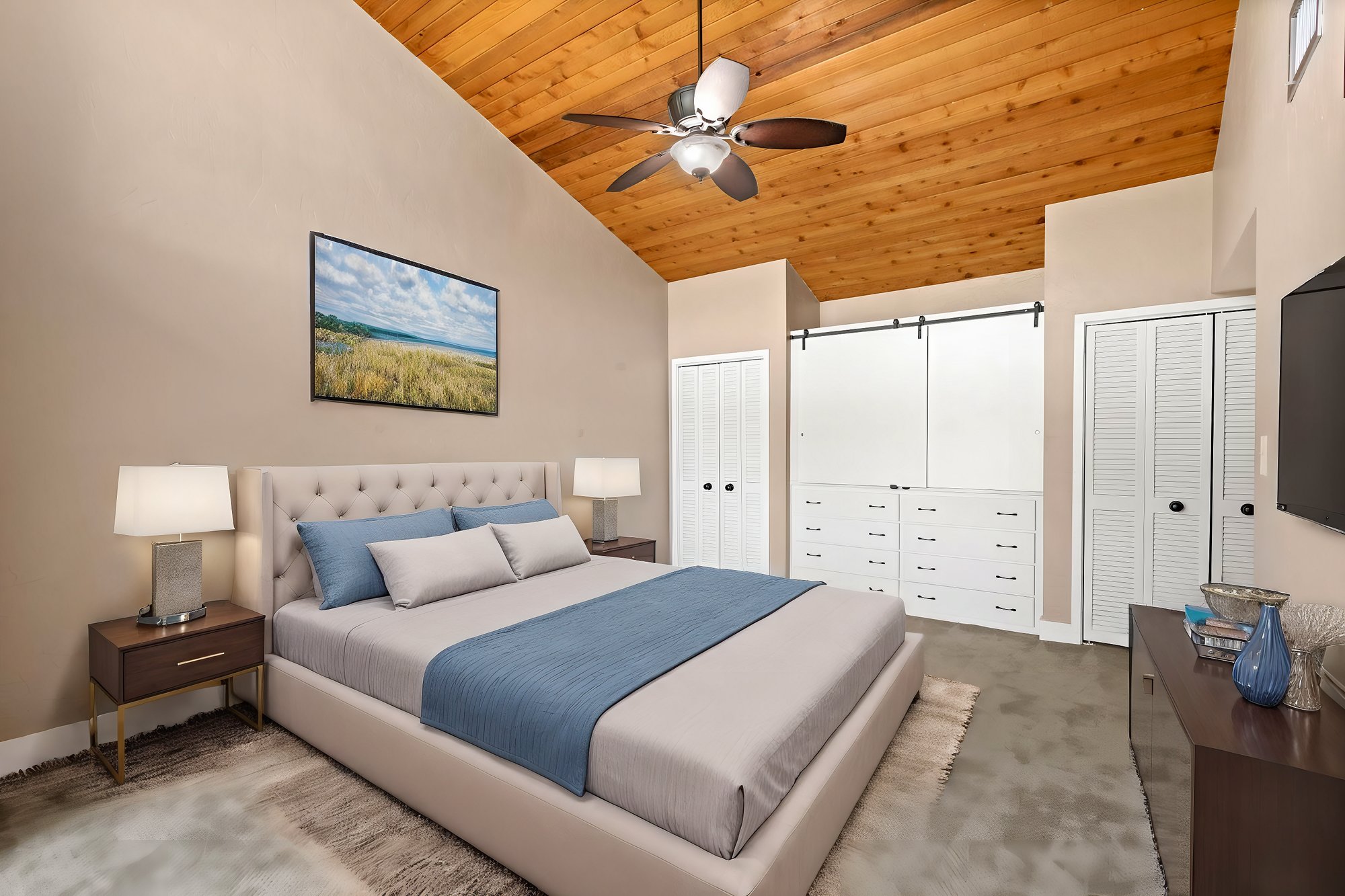 bedroom with white closet doors and wall cabinet with bedroom furniture